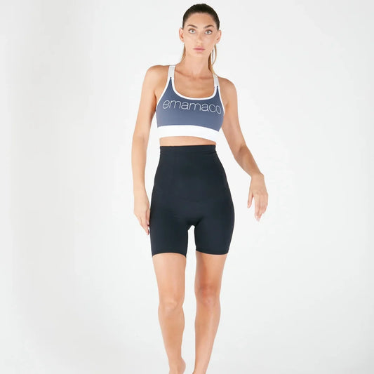 Woman wearing lilac high-waisted postpartum recovery leggings with pockets.